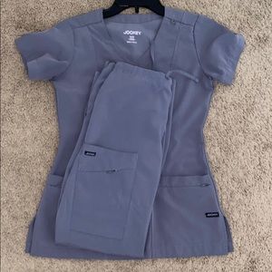 Grey Jockey scrub set in xxs cargo pants and top.
